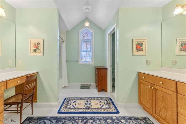 bathroom featuring a shower with curtain, tile patterned flooring, vanity, and lofted ceiling