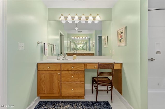 bathroom with tile patterned flooring and vanity