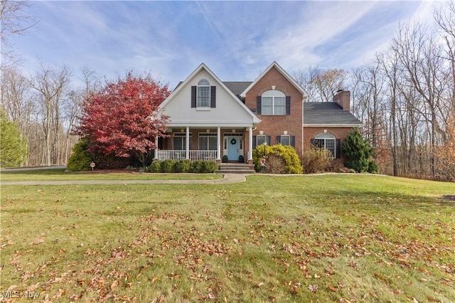 view of front facade featuring a front lawn and a porch