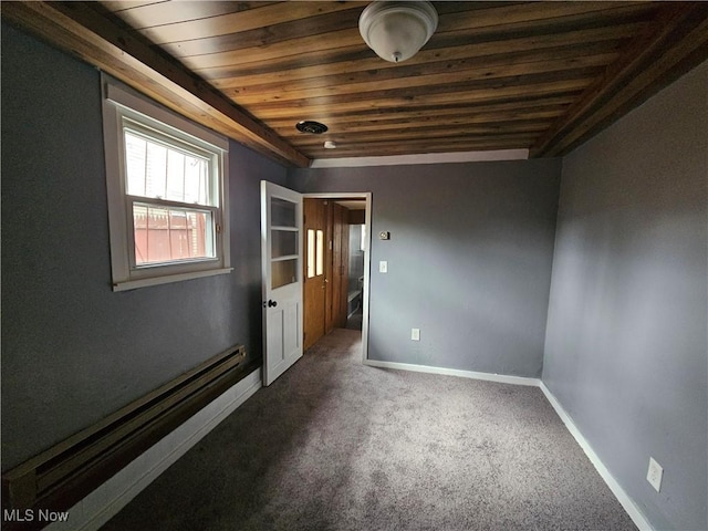 unfurnished room featuring baseboard heating, carpet, and wooden ceiling