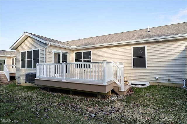 back of property featuring central air condition unit and a wooden deck