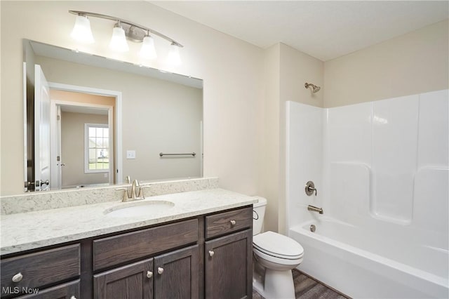 full bathroom with wood-type flooring, vanity, toilet, and shower / bathtub combination