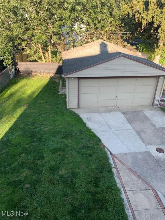 garage featuring a yard