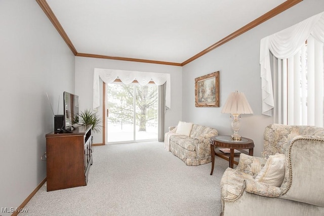 sitting room with light colored carpet and ornamental molding