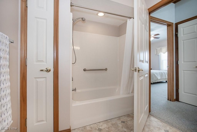 bathroom featuring ceiling fan and shower / bath combo with shower curtain