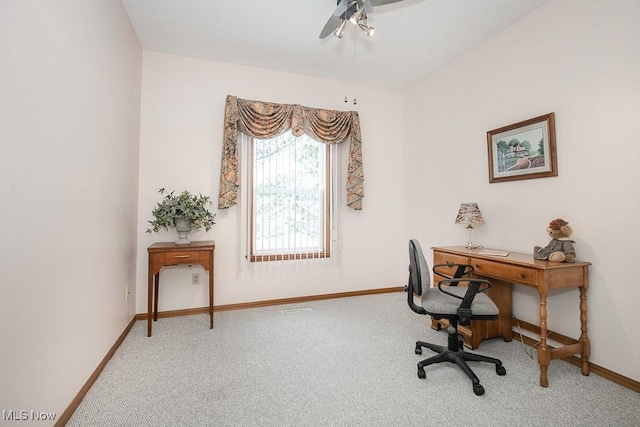 carpeted office with ceiling fan