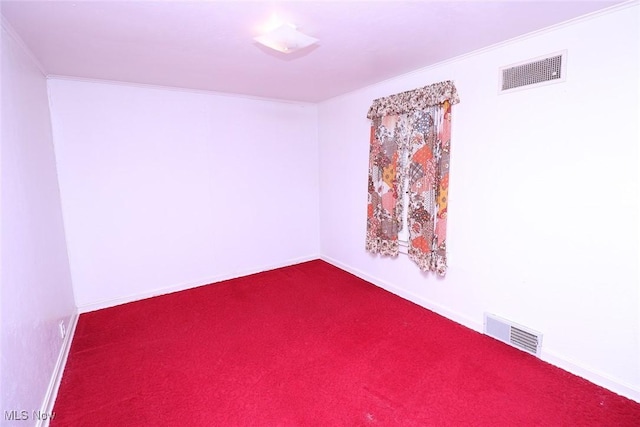 carpeted spare room with ornamental molding