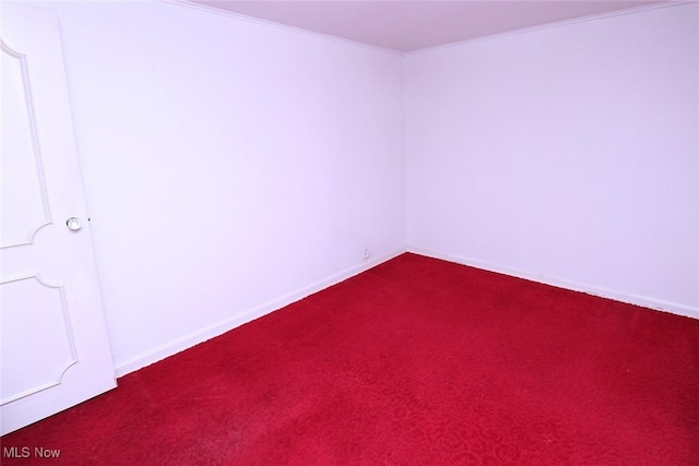 carpeted empty room with crown molding