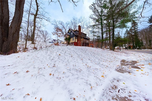 view of yard layered in snow