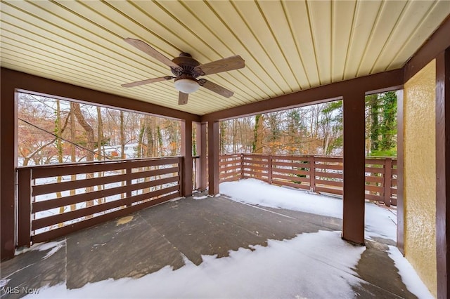 snow covered deck featuring ceiling fan