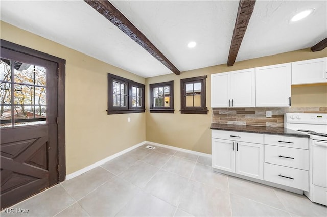 kitchen featuring white range with electric cooktop, decorative backsplash, beam ceiling, and white cabinets