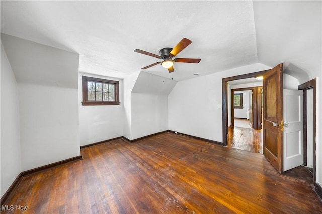 additional living space with dark hardwood / wood-style flooring, ceiling fan, and lofted ceiling