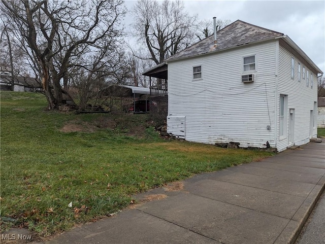 view of property exterior featuring a lawn