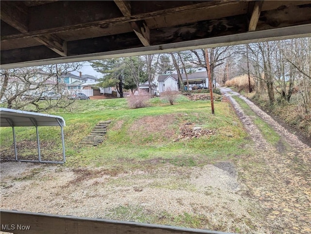 view of yard with a carport