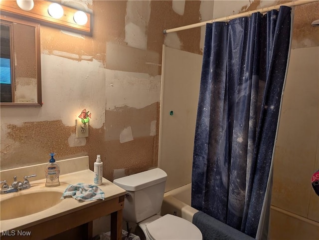 full bathroom featuring shower / bath combination with curtain, toilet, and sink