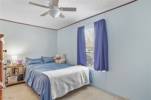 bedroom with light carpet, a textured ceiling, and ceiling fan