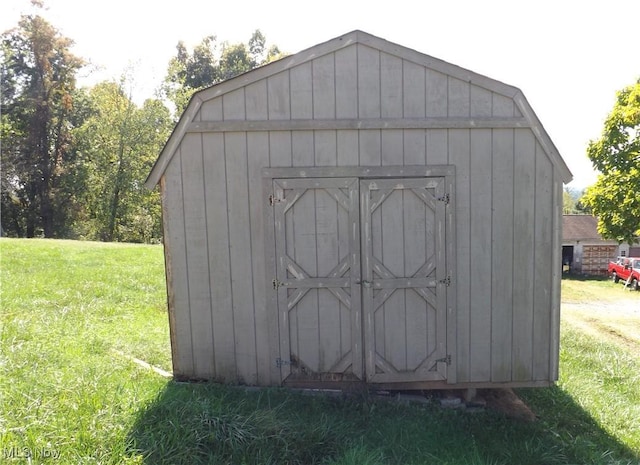 view of outdoor structure with a lawn