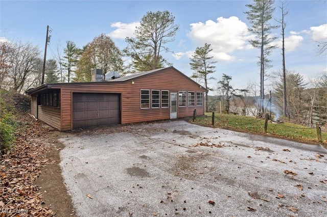 view of side of property with a garage