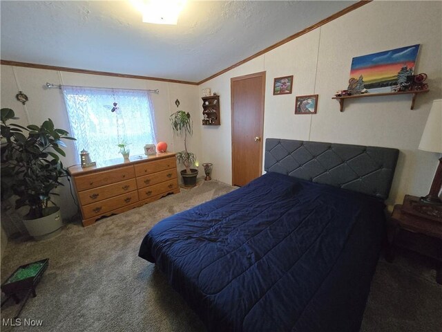 bedroom with carpet flooring, crown molding, a textured ceiling, and lofted ceiling