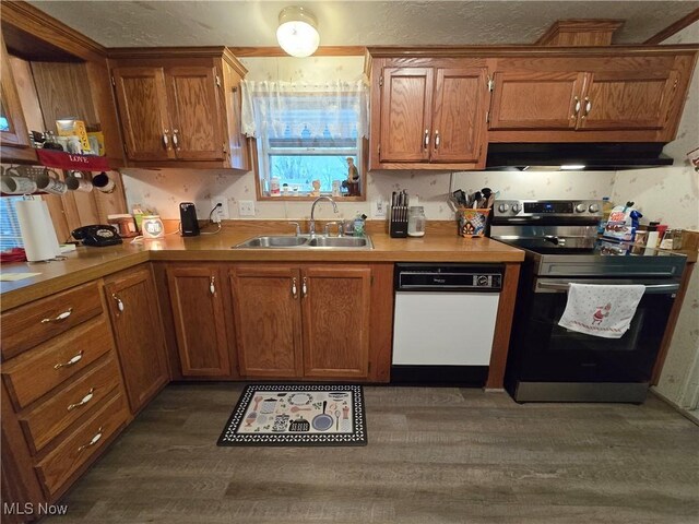 kitchen featuring dark hardwood / wood-style flooring, white dishwasher, exhaust hood, sink, and electric stove