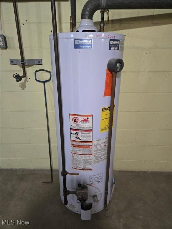 utility room with gas water heater