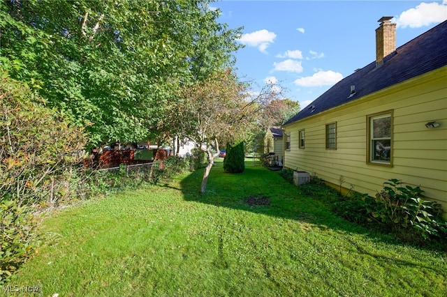 view of yard with central air condition unit