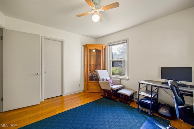 office area featuring light hardwood / wood-style floors and ceiling fan