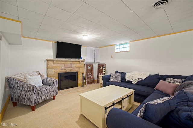 carpeted living room featuring a fireplace