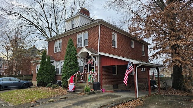 view of front of house with cooling unit and central AC