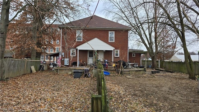 back of property featuring a deck