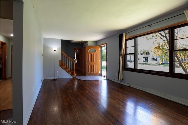 entrance foyer with a baseboard heating unit and hardwood / wood-style flooring