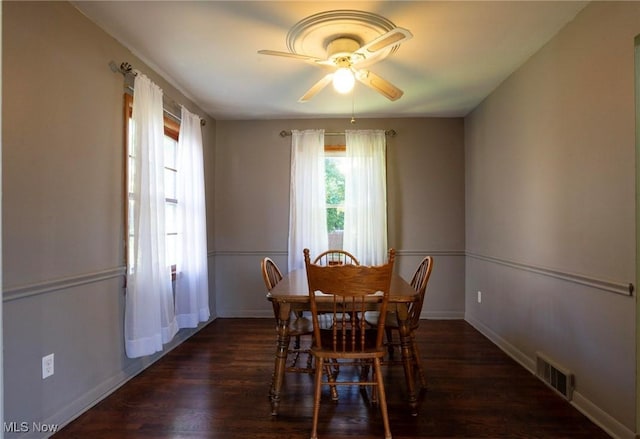 dining space featuring dark hardwood / wood-style floors and ceiling fan