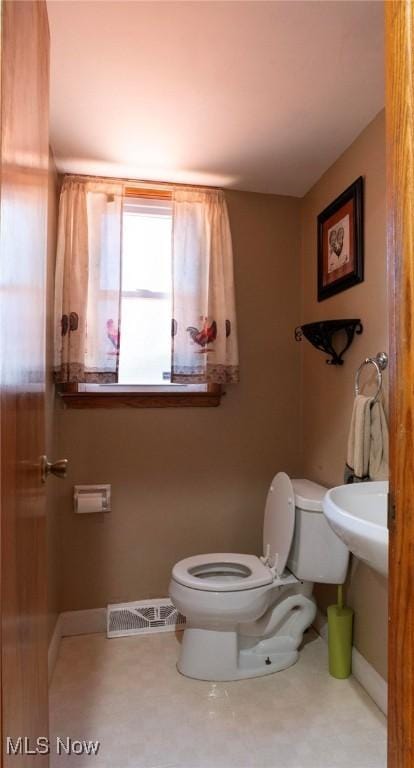 bathroom featuring toilet