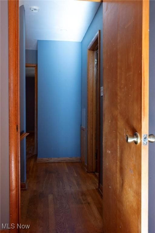 hallway featuring dark hardwood / wood-style floors