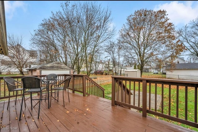 wooden deck featuring a storage shed