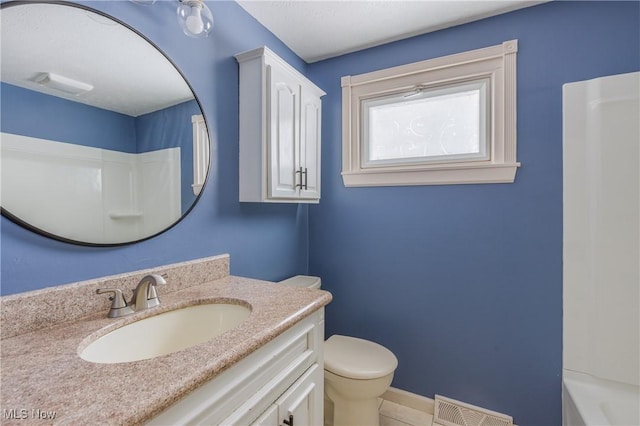 full bathroom with tile patterned flooring, vanity, shower / bath combination, and toilet