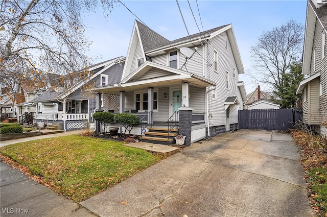 view of front of home with a front lawn and a porch