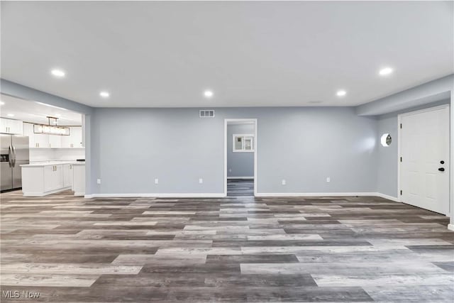 unfurnished living room featuring light hardwood / wood-style floors