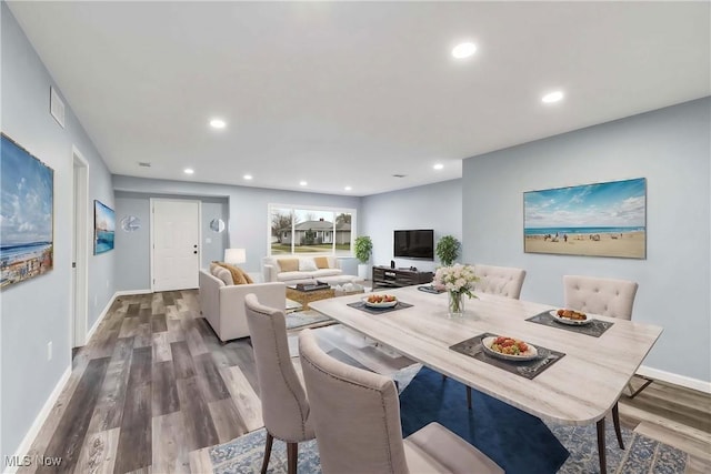 dining area with hardwood / wood-style floors