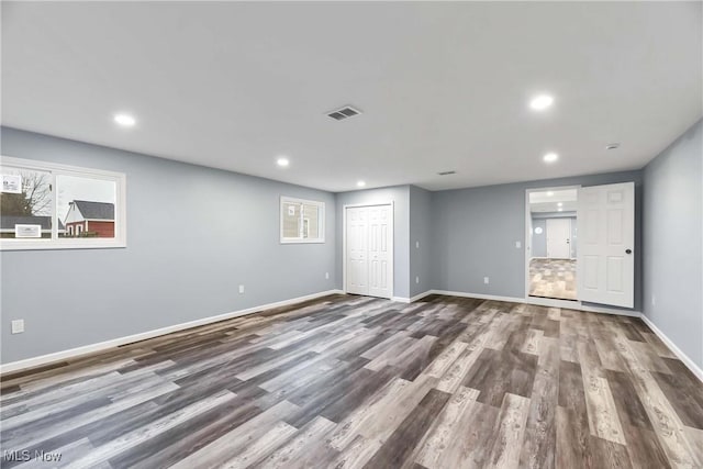 spare room with wood-type flooring