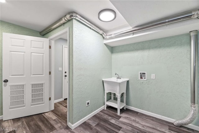 laundry area with hookup for a washing machine, electric dryer hookup, and dark wood-type flooring