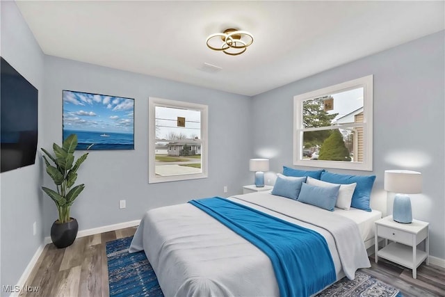 bedroom featuring dark hardwood / wood-style floors