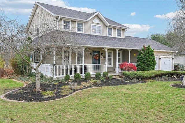 country-style home featuring a front yard, a porch, and a garage