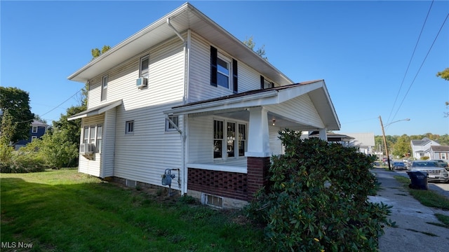 view of side of home featuring a lawn