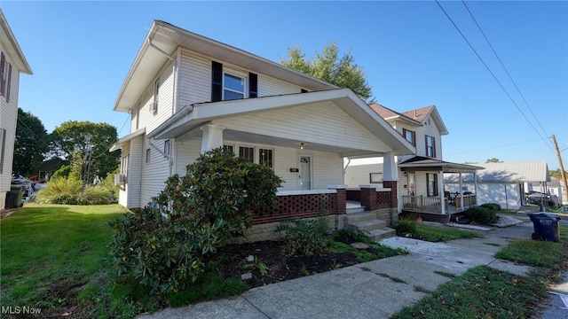 view of front of property featuring a front lawn and a porch