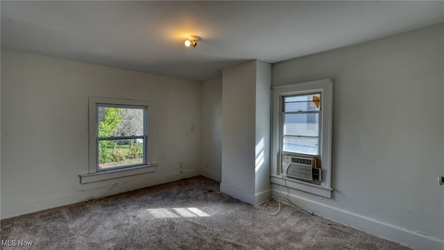 carpeted spare room with cooling unit