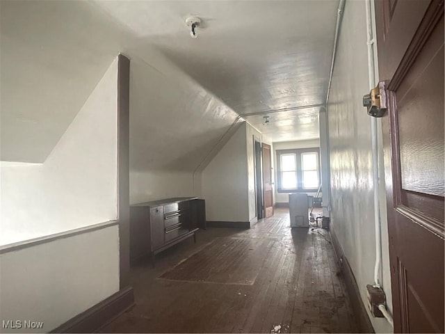 bonus room featuring dark hardwood / wood-style flooring and lofted ceiling