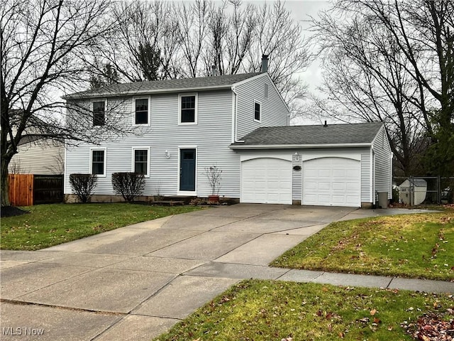 view of front facade with a garage and a front lawn