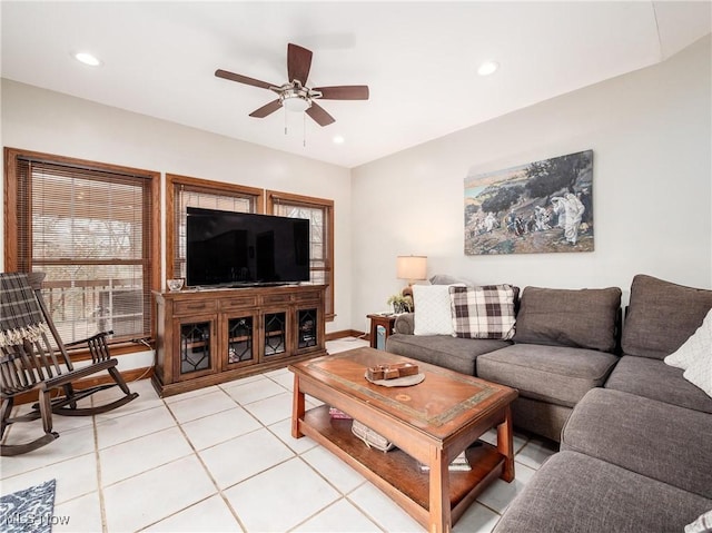 tiled living room featuring ceiling fan