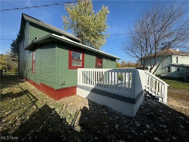 view of side of home featuring a deck